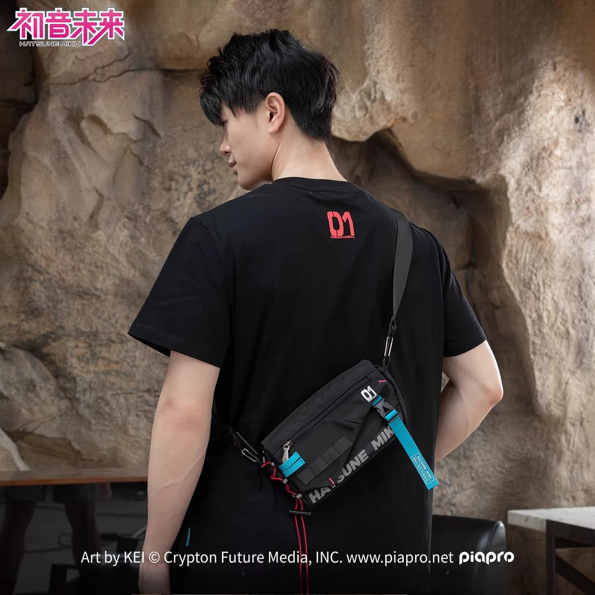 Black Hatsune Miku crossbody bag worn across back